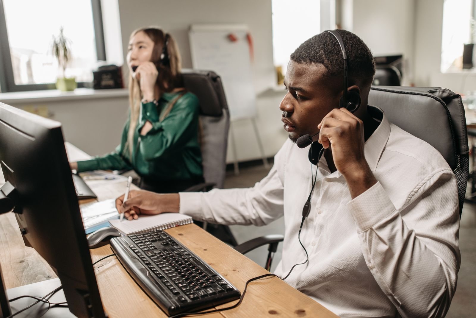 Person on a phone call providing friendly customer support
