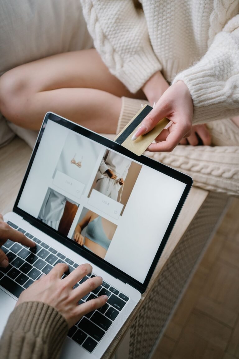 Two people reviewing a purchase on a laptop