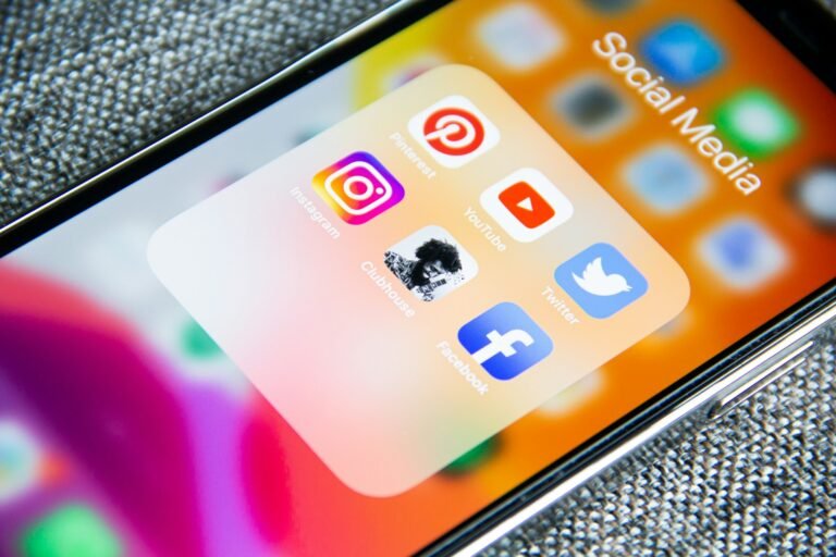 Close-up of social media app icons on a smartphone screen