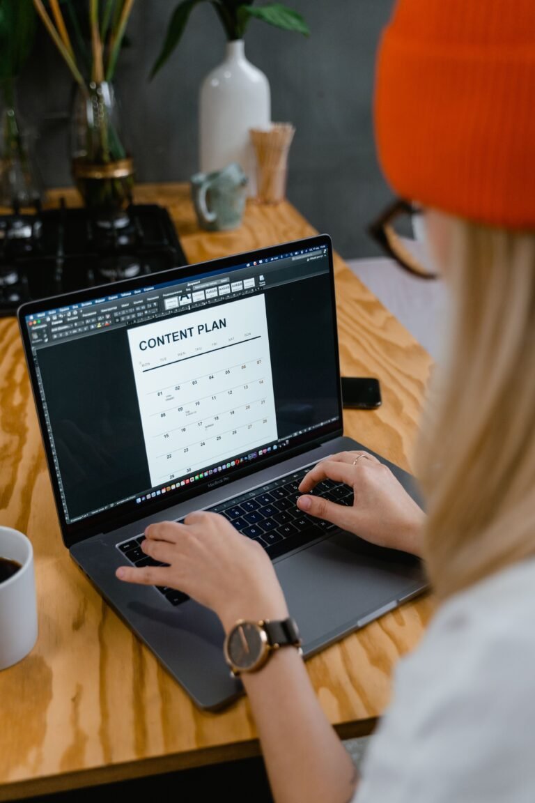 Content calendar planning for social media marketing strategy on a laptop