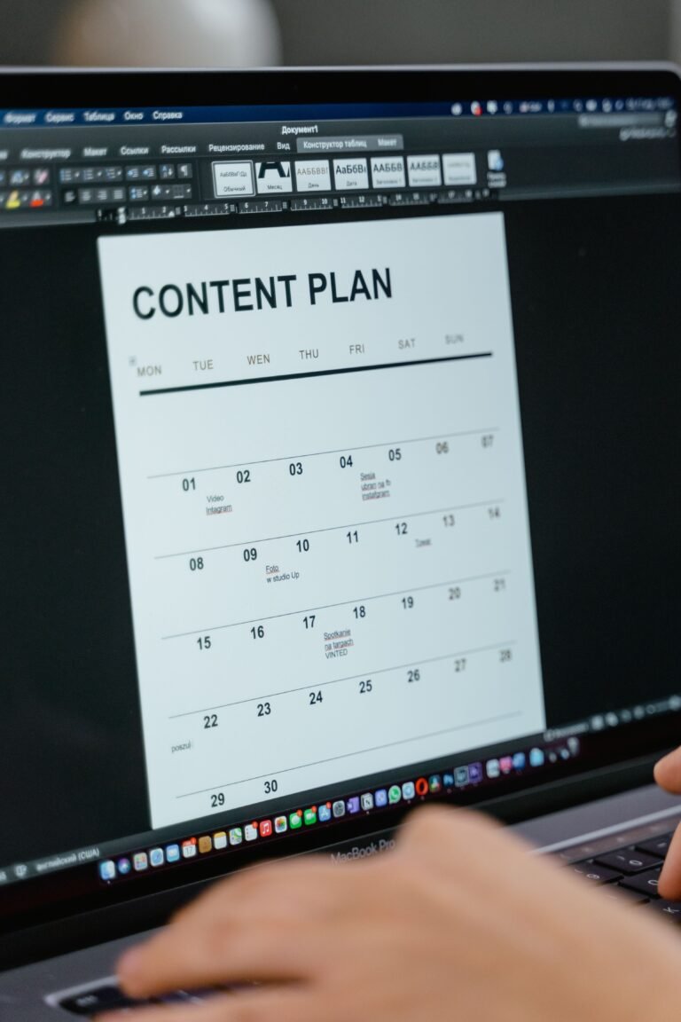 Person planning a social media posting schedule at a desk
