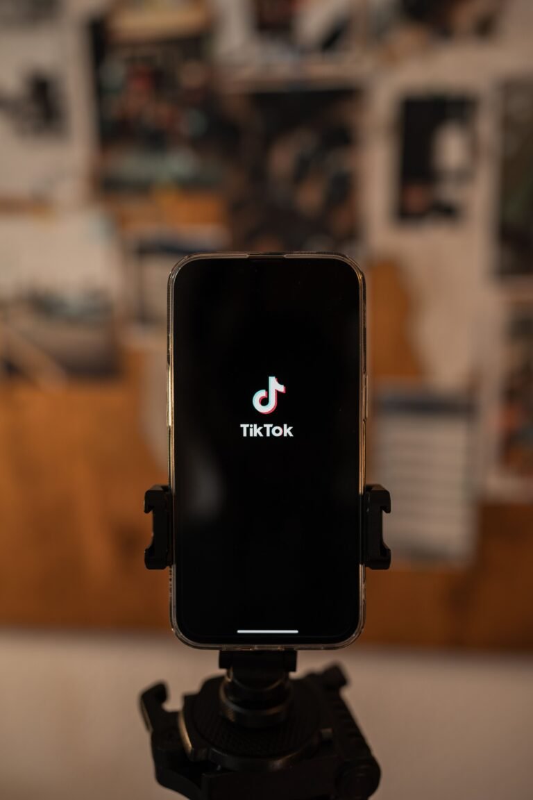 Mobile phone mounted on a tripod set up for filming TikTok video ads